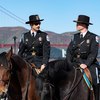 Mounted police officers on their horses near the San Francisco Golden Gate Bridge.