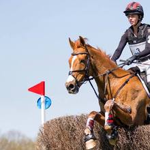 Caroline Martin riding in horse competition.