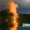 Wild fire on mountain side near bay in Australia