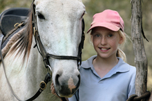 A happy girl with her horse.