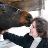 Horse and Dr. Kellon showing mutual affection for each other.