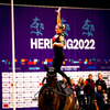 Kimberly Palmer with her horse showing her skills in FEI Competition