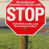 Sign warning unauthorized traffic that biosecurity measures are in effect on property.