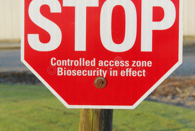 Sign warning unauthorized traffic that biosecurity measures are in effect on property.