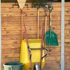 Wheelbarrow, rakes, shovel and other tools helpful in stall and barn cleaning.