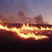 A wildfire racing through farmland near Elko Nevada
