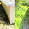 Before and after photos showing how installation of a French drain improves drainage.