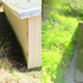Before and after photos showing how installation of a French drain improves drainage.