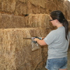 Using a hay probe to get samples of hay for analysis.