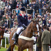 Crowd enjoying a horse show.