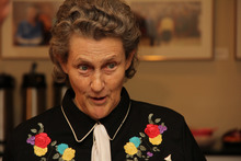 Dr. Temple Grandin speaking at a symposium.