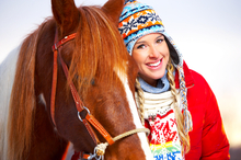 A girl with her pinto horse