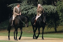 Queen Elizabeth riding her horse Burmese with President Reagan