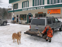 Hunter transporting deer