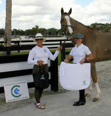 Allyn Maix of Choice of Champions presents Heather Mason and Zar with Choice of Champions Performance Award