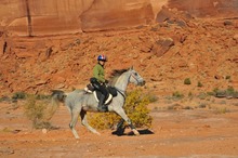 Beverly Gray riding near scenic Moab, Utah