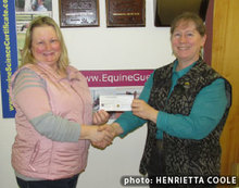 Nancy Kavanagh, EFC rep., presents  check to Equine Guelph director, Gayle Ecker